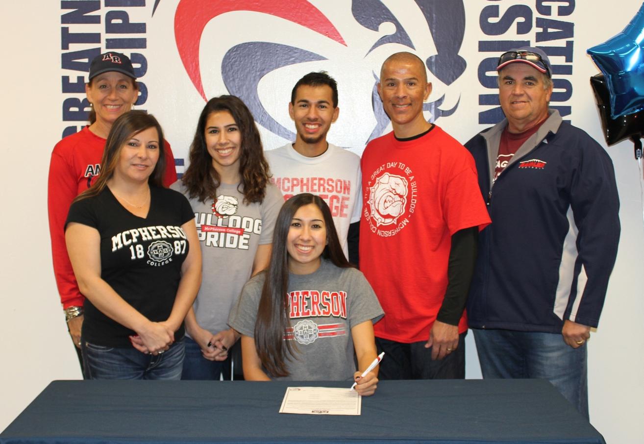 Aryana with her family, high school coach, and ARC Coach Powless