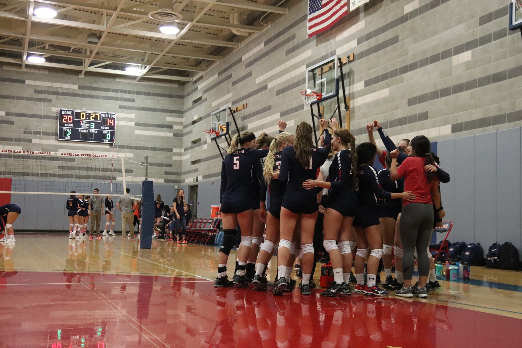 Picture of Volleyball team in a huddle